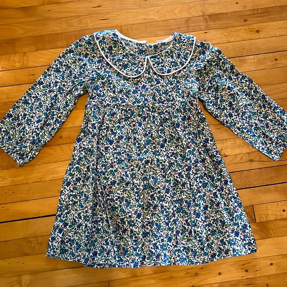 Adorable floral dress with back button detail!